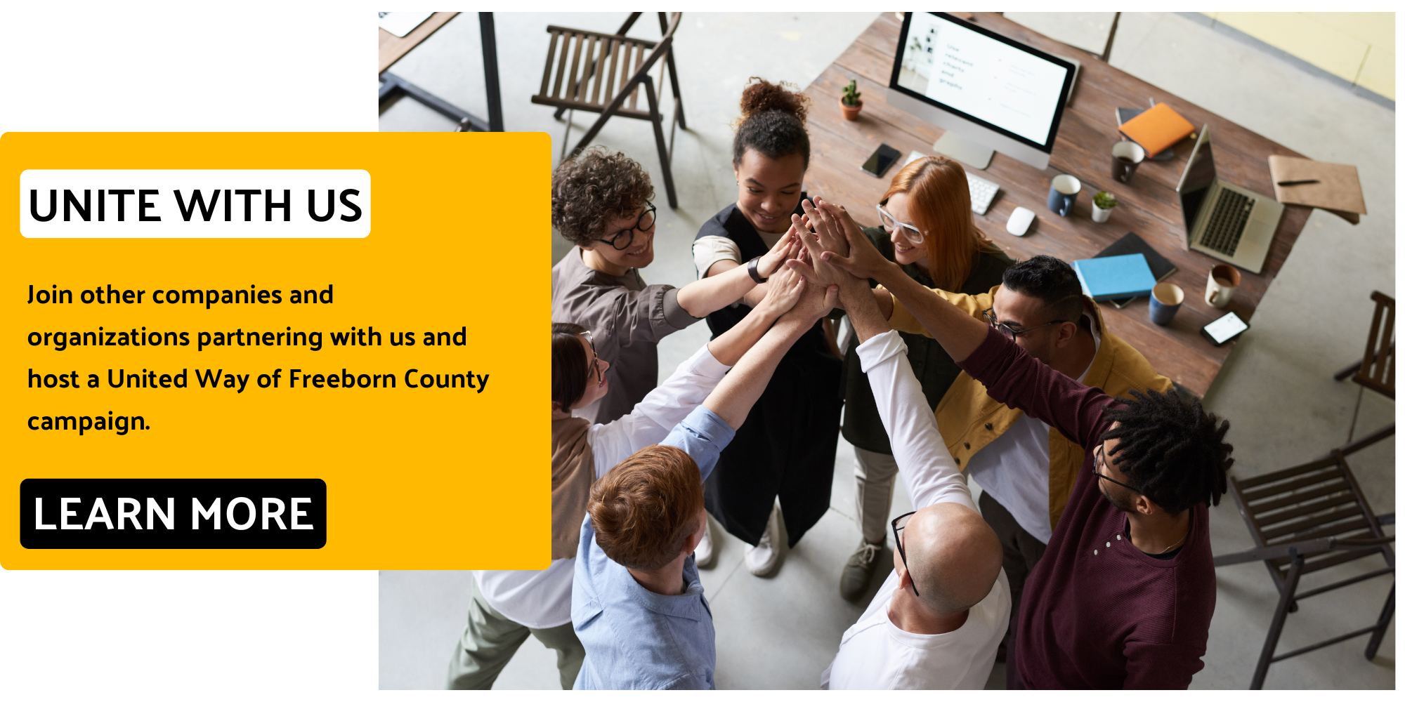 Group high five in business setting
