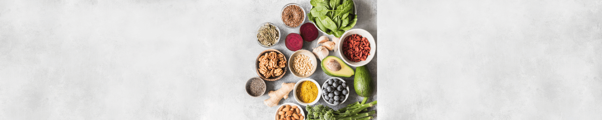 A variety of nutritious, fresh foods are displayed appealing on a flat surface.